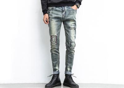 China Grey Skinny Men'S Denim Jeans Button Pockets Customised Logo Anti Shrink for sale