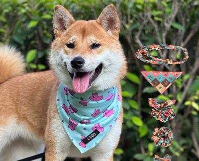 China Padded Dog Bow Saliva Towel Cat Triangle Towel Set Custom Pattern Elastic Hair Rope for sale