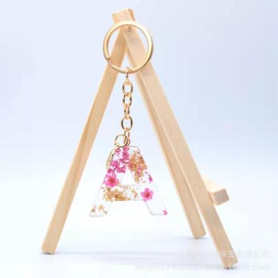 China Bag Charm 2021Cross-border Letter Key Chain Flower Resin Explosion Bag Handmade Real Dry Pendant for sale