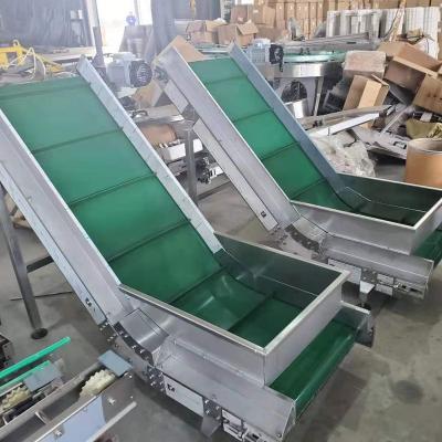 China Heat Resistant Oblique Automatic Adjustable Belt Conveyor for sale