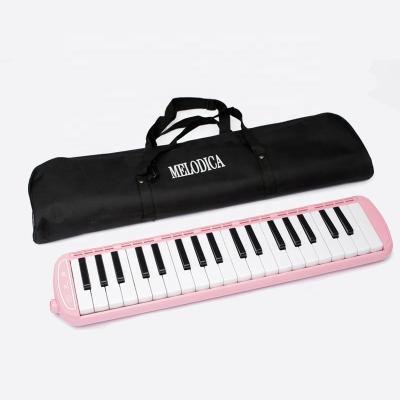 China Music Lovers Beginners Gift 37 Key Harmonica Instrument Air Piano Keyboard For Music Lovers With Mouthpiece Hose Pink Carrying Bag for sale