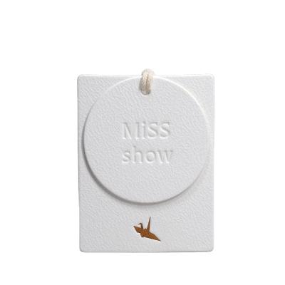 China Sustainable Recycled High Quality Eco Friendly Perfume Hangtag Label Paper Embossed Thick Jewelry Custom Luxury Apparel Hang Tags For Clothe for sale