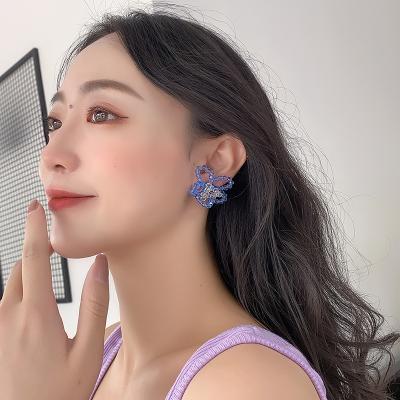 China 2022 TRENDY designer fashion hand - woven flower stud earrings for women for sale