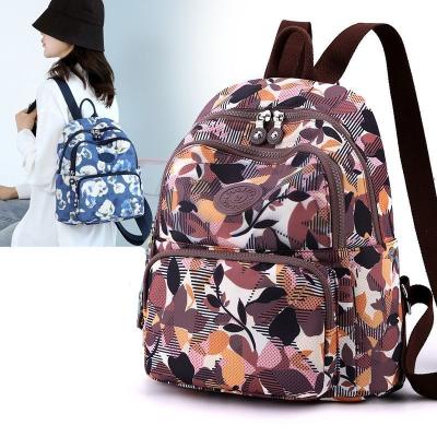 China Cheap Waterproof Fashion Girl's University Printed Lightweight Nylon Lady Bags Large Capacity Travel Outdoor Student School Backpack for sale