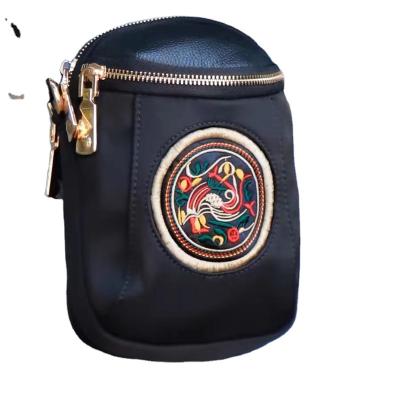 China New waterproof mini pocket vertical shoulder phone bag Oxford hand-embroidered coin purse women for sale