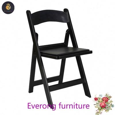 China Modern White Padded Resin Folding Chair for sale