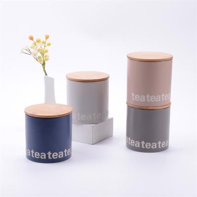 China Freshness Preservation INS Style Letter Printing Tea Storage Boxes With Bamboo Home Decor Lid Porcelain Ceramic Tea Cart for sale