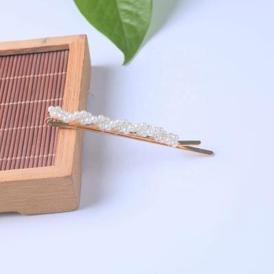 China Newest Fashionable Iron+Pearl Bobby Pin Imitation Pearl Twisted Hair Clips With Pearls For Women Girls for sale