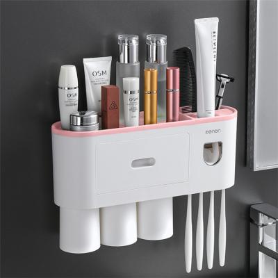 China New Viable Wholesale Bathroom Accessories Wall Mounted Automatic Toothpaste Dispenser Toothbrush Holder With Three Cups for sale