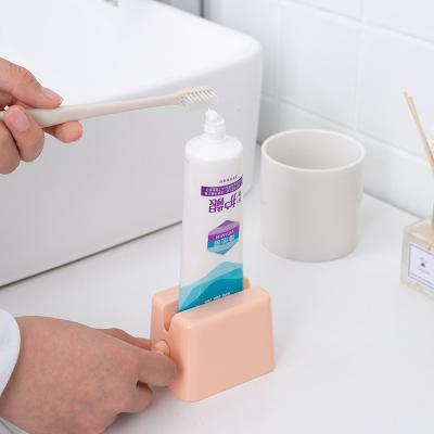 China Viable OEM Custom Design Multifunctional Bathroom Products Plastic Toothpaste Tube Squeezer Dispenser And Holder for sale