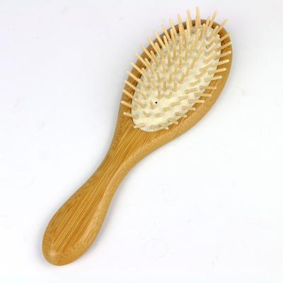 China Hot Sale Natural Bamboo Oval Cushion Paddle Detangling Custom Hair Brush for sale