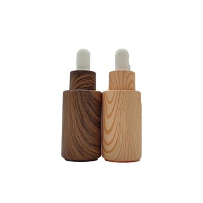 China Small Batch Flat Strap Cosmetic Glass Dropper Support Customized Transparent Frosted Bottle for sale