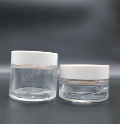 China Hot Sale Cosmetic New In Stock With Clear Amber White Black Round Cap And Box Glass Bottle for sale