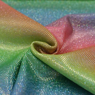 China Rainbow Color Sequin 82% Polyamide 18% Elastane Stretch Swimwear Activewear Suit Reflective Foil Fabric for sale