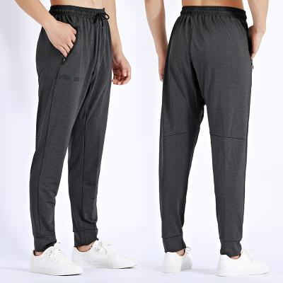 China OEM Breathable Fitness Wear Active Sports Drawstring Casual Training Running Workout Pants Plus Size Sports Loose Pants With Zipper Pockets for sale