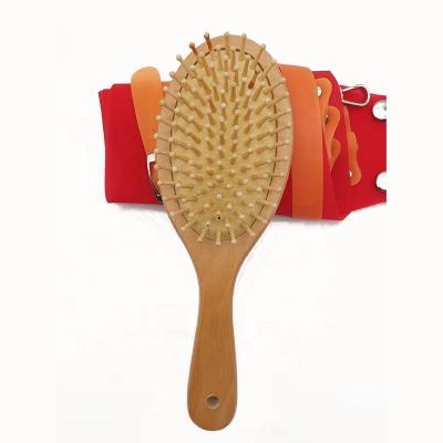 China Eco-friendly comfortable cushion massage wooden comb paddle comb wooden hair comb detangling brush for sale