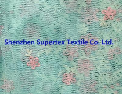 China Children'S Clothing Fabric Polyester Mesh Lt. Green Rubber Glitter Flowers Border Print for sale