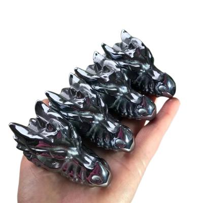 China Europe hot sale hand carved quartz stone carving terahertz dragon head skulls crystal dragon  for Home Decoration for sale