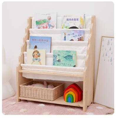 China Nordic Style Convertible Book Holder Small Diary Student Kindergarten Picture Book Shelf Kids Floor Storage Solid Wood Rack for sale