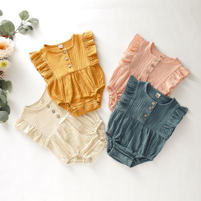 China Eco-friendly Washable Breathable Canvas Newborn Babies Kids Muslin Ruffle Plain Baby Clothes Rompers for sale