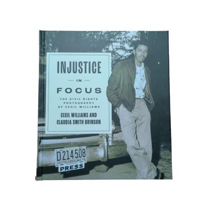 China Injustice In Focus Matte Laminated Hardcover Art Book With Smyth Sewn Binding And 4C/4C Glossy Art Paper Inner Pages for sale