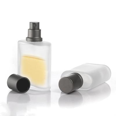 China Wholesale Cosmetic 30ml Transparent Perfume Bottle Frosted Refillable Glass Bottle With Pump Spray Lid for sale