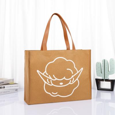 China Manufacture Washable Kraft Paper Handled Tote Bag Kraft Shopping Bag With Leather Handle for sale