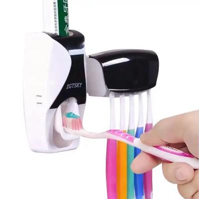 China Sustainable Family Dustproof Toothpaste Wall Mounted Kids Hands Free Toothpaste Squeezer Toothbrush Holder Toothpaste Dispenser Set for sale