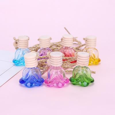 China Lady Gift Pendant Essential Lover Cosmetic Oil Diffuser Ornaments Rose Flower Shape Car Perfume Glass Air Freshener Pendant Empty Bottle for sale