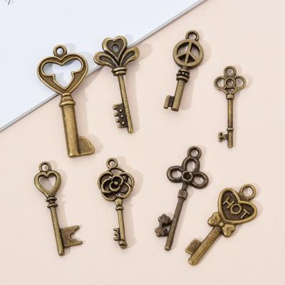 China CLASSIC Mixed Bell Keys Charms Vintage Metal Bronze Zinc Alloy Fine Mixed Fashionable Pendant Charms For Jewelry Making for sale