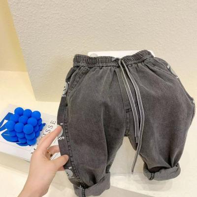 China 2021 Autumn New Children's Face Denim Breathable Casual Smile Pants for sale