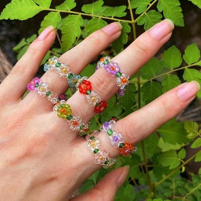 China Fashion Crystal Bead Elastic Ring Wholesale Candy Color Bead Knitted Flower Ring Jewelry Accessory for sale