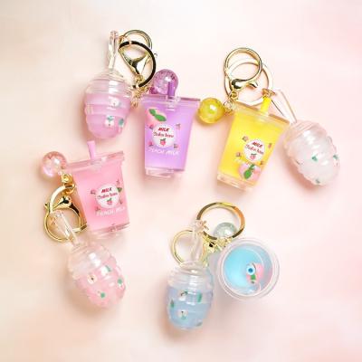 China Wholesale Waterproof Private Label Peach Floating Cute Milk Tea Cup Lip Annotate Key Chain Honey Lip Oil Lip Pendant Without Logo for sale