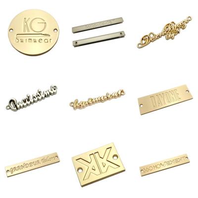 China Fashion Sustainable Gold Custom Name Ornaments Brand Label Holes Sewing On Metal Tag For Garment for sale