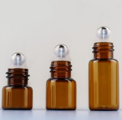 China Package 1ml 2ml 3ml 5ml Mini Oem Empty Round Transparent Glass Rollerball Bottle Brown Essential Oil Bottle for sale