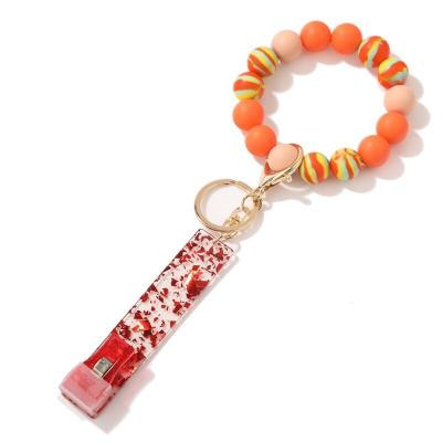 China Eco-Friendly Silicone Key Ring Bracelet Credit Card Grabber For Key Long Studs Chain Bracelet Gift For Women Girl for sale