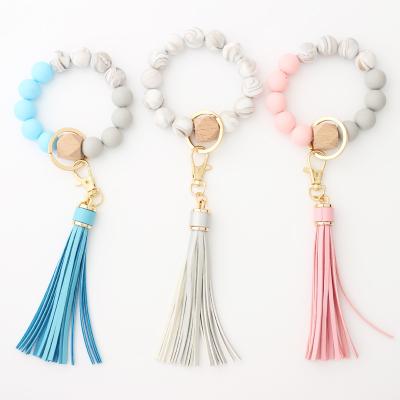 China 2021 Custom Silicone Beads Elastic Leather Bracelet Bangle Key Chain Tassel Eco-friendly Silicone Beads Bracelet Bangle Key Chain for sale