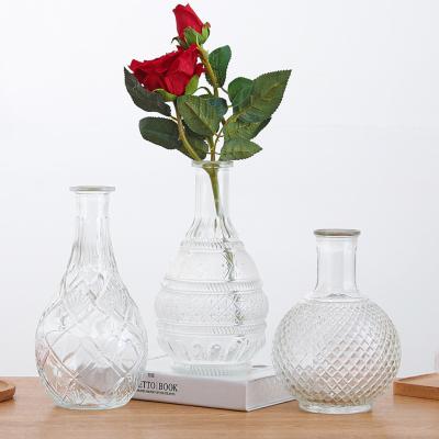 China Wholesale modern decoration European clear flower fashion basso-relievo glass vases for sale