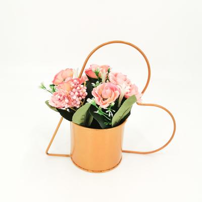 China Artificial flower wholesale price plastic modern home decor open plastic flowers with metal heart shaped vase for sale