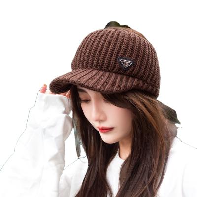 China New style 2021 fall winter hat JOINT empty top warm crochet slouchy beanie knitted visor sports hats with brim for ladies for sale