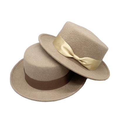 China 2021 plush topi fadora OEM/ODM 100% wool felt wholesale wide brim branded quality rhinestone flat surface felt hat hats for women for sale