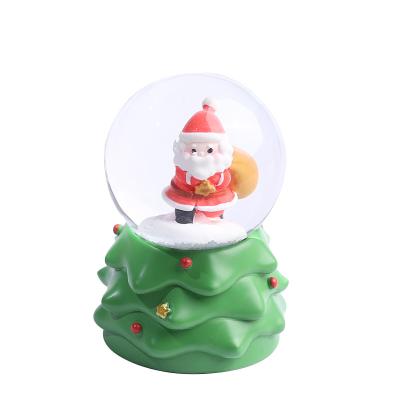 China 2023 Folk Art Christmas Tree Santa Claus Resin Craft Crystal Ball With Lights Figure Statue Snowflake Home Decoration for sale