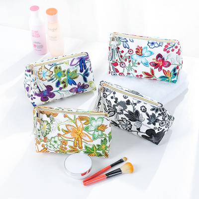 China 2021 new fashion Korean version of flower tassel makeup bag girl lovely heart portable toiletries wash bag for sale