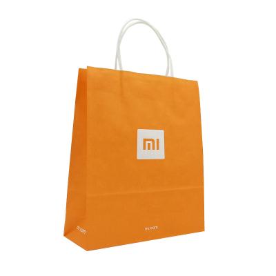 China Recycled Materials Factory Supply Gift Orange Color Customized Paper Bag With Customer Logo And Handles for sale