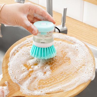 China Sustainable Kitchen Dish Washing Brush Dishwashing Sponge Cleaner Small Handheld Kitchen Cleaning Brush With Liquid Dispenser for sale