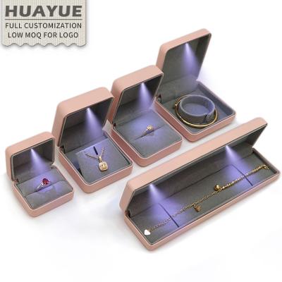 China Wholesale Pink Round-Corner Ladies PU Flip Bracelet Necklace Ring Women's LED Light Leather Jewelry Boxes Ring Bracelet Necklace Earring Jewelry Boxes With Velvet Insert for sale