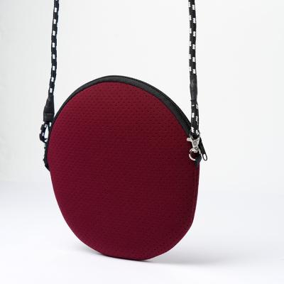 China Portable Round Messenger Small Bag Neoprene Sling Bag for sale