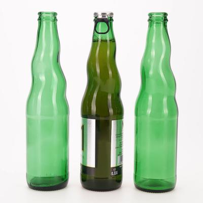 China Unique Shaped Glass Bottles 500ml 700ml Emerald Green Beer Glass Customizable Empty Beverage Beverage Bottle SIGHT With Crown Cap for sale