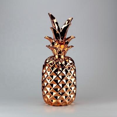 China Contemporary gold plated ceramic pineapple jar for home decor for sale