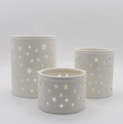 China Contemporary Promotional Hand Made Porcelain Tealight Lantern With Stars Design for sale